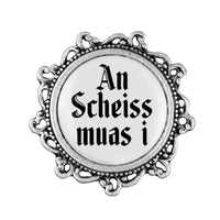 Gaudiknopf "An Scheiss muas i" verziert